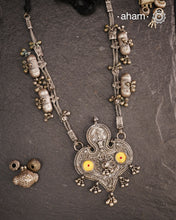 This Tribal Silver Neckpiece from Gujarat embodies the rich heritage of the Rabari community in the Kutch region. Featuring a distinctive arrowhead amulet pendant (chagda) flanked by traditional amulet chains (madaliya), this handcrafted silver piece carries generations of cultural significance. Wearing it connects you to timeless traditions while adding a unique, authentic touch to your style.