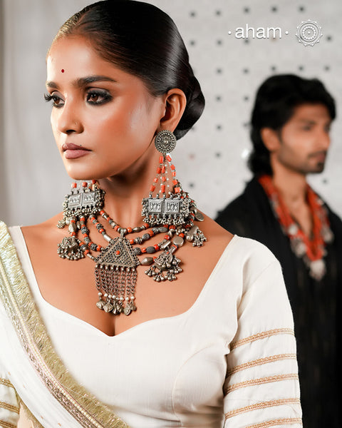 This Tribal Coral Silver Neckpiece draws inspiration from the rich heritage of Yemen’s traditional jewelry. Expertly crafted in silver, it combines vintage elements with carefully selected coral beads to create a unique, timeless piece. The blend of old and new beads offers a distinctive aesthetic that honours cultural artistry while providing a refined accessory for contemporary wear.