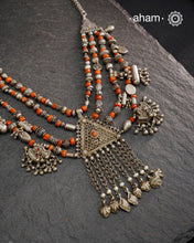 This Tribal Coral Silver Neckpiece draws inspiration from the rich heritage of Yemen’s traditional jewelry. Expertly crafted in silver, it combines vintage elements with carefully selected coral beads to create a unique, timeless piece. The blend of old and new beads offers a distinctive aesthetic that honours cultural artistry while providing a refined accessory for contemporary wear.