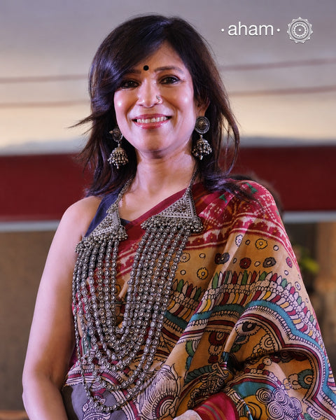 This Tribal Multi Line Silver Neckpiece is a magnificent classic Rani haar featuring seven intricately crafted lines, known as Satlada. It is adorned with a delicate floral pattern and accented by two prominent triangular motifs at each end. This vintage design exudes timeless elegance and cultural richness, making it a treasured heirloom piece meant to be passed down through generations. A neckpiece truly fit for a queen.