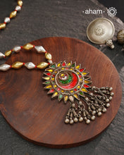 Long silver neckpiece made by putting together unique vintage tribal silver glass piece with a silver drop. Looks great when paired with workwear kurtas, saris or even a shirt.
