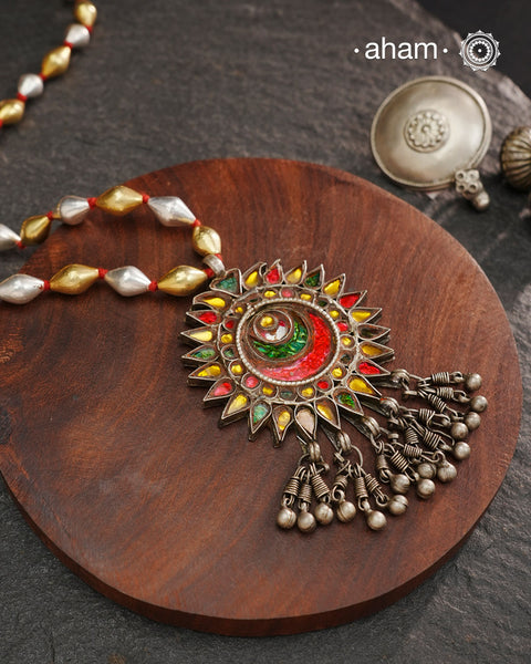 Long silver neckpiece made by putting together unique vintage tribal silver glass piece with a silver drop. Looks great when paired with workwear kurtas, saris or even a shirt.