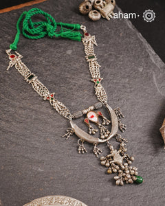Tribal silver neckpiece handcrafted by threading together multiple tribal . This necklace truly exemplifies the continuity of the traditional prototypes.