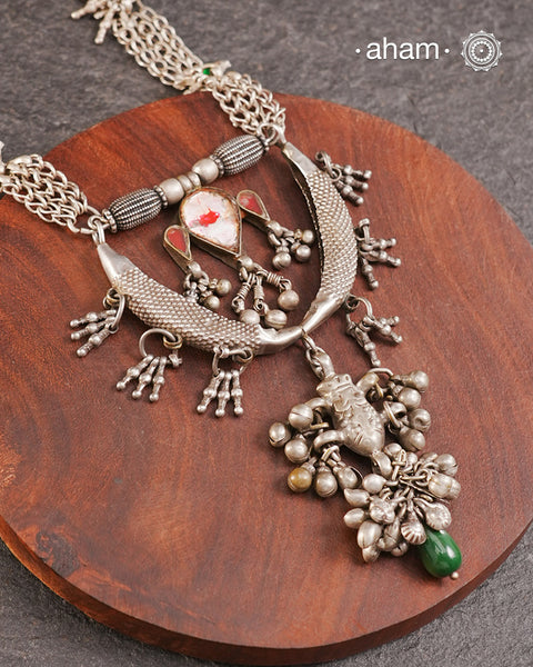 Tribal silver neckpiece handcrafted by threading together multiple tribal . This necklace truly exemplifies the continuity of the traditional prototypes.