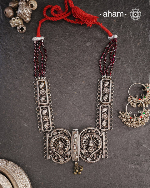 Tribal silver neckpiece handcrafted by threading together multiple tribal . This necklace truly exemplifies the continuity of the traditional prototypes.
