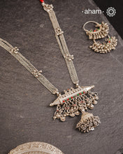 This tribal silver neckpiece features an amulet pendant and traditional side belts, reflecting the rich heritage of Rajasthan and Gujarat. Crafted entirely in silver, it offers a unique blend of cultural artistry and timeless elegance. Perfect for those who appreciate authentic, handcrafted jewellery.