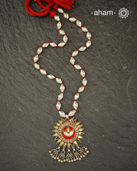 Beautiful handcrafted tribal silver glass pendant from a bygone area, that bring back memories and stories of that time. Threaded on a classic Dholki Chain.