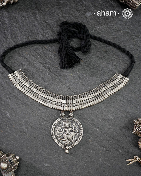 This Tribal Silver Neckpiece combines unique tribal elements, meticulously handcrafted in silver to create a one-of-a-kind statement accessory. Its distinct design highlights traditional craftsmanship, offering both cultural richness and timeless elegance for those who appreciate expert artistry.