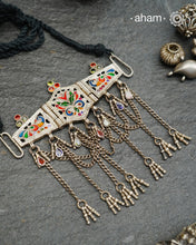 Rooted in tribal heritage, this tribal cutwork silver choker features exquisite cutwork detailing originally designed as a bajuband. We've thoughtfully adapted this traditional form into a contemporary neck piece that captures the same artisanal essence. Exceptionally lightweight and comfortable for extended wear, it pairs beautifully with layered styling, allowing you to create sophisticated, multi-dimensional looks. A refined fusion of cultural craftsmanship and modern sensibility.