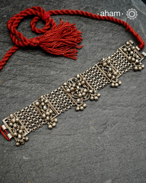 Originally a classic bracelet design converted into a choker.Beautiful ghungroos that add rhythm. Crafted in silver.Pair it with your shirt or ethnic wear. looks great.