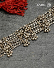 Originally a classic bracelet design converted into a choker.Beautiful ghungroos that add rhythm. Crafted in silver.Pair it with your shirt or ethnic wear. looks great.