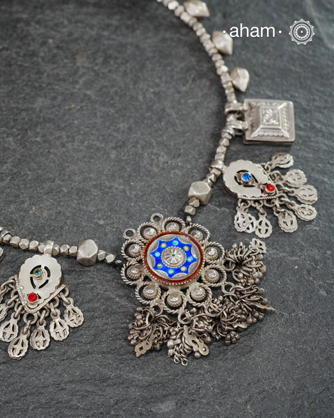 This Tribal Silver Neckpiece combines unique tribal elements, meticulously handcrafted in silver to create a one-of-a-kind statement accessory. Its distinct design highlights traditional craftsmanship, offers both cultural richness and timeless elegance.