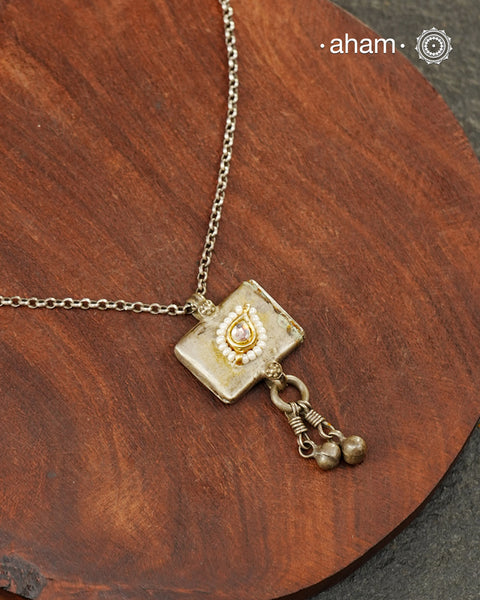 Small tribal silver amulet box with a subtle kundan highlight. Comes with a link chain.
