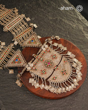An extraordinary statement piece, this elaborate silver necklace brings together the bold geometry, vivid colour and intricate metalwork associated with the jewellery traditions of Afghanistan.