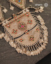 An extraordinary statement piece, this elaborate silver necklace brings together the bold geometry, vivid colour and intricate metalwork associated with the jewellery traditions of Afghanistan.