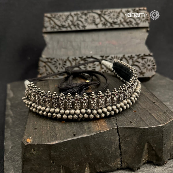 Vajratik is a bold traditional Maharashtrian necklace with the beautiful blend of Jondhale Mani - which translates to jowar grain. Handcrafted in 92.5 sterling silver.

Also known as the Mahalaxmi Gadi Thushi, it is a well know jewellery ornament from kolhapur, finding its history since the Mahalaxmi Mandir. This piece of jewellery has also been seen on the statue of the goddess inside the temple.