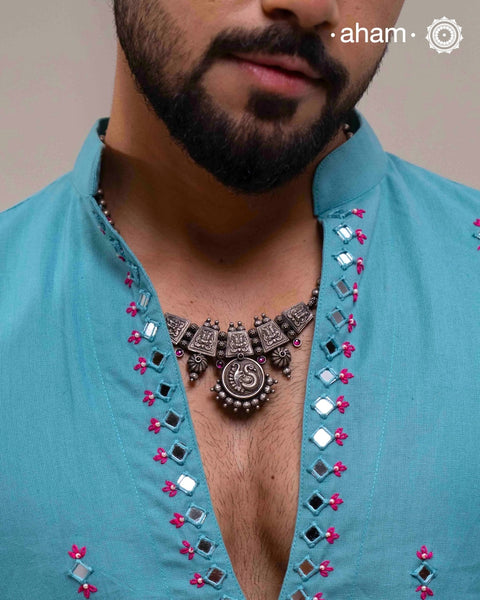 Beautiful 92.5 Sterling Silver handcrafted neckpiece with peacock motif pendant and yali with kemp stone highlights. Crafted by experts in kolhapur.
