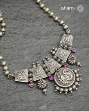 Beautiful 92.5 Sterling Silver handcrafted neckpiece with peacock motif pendant and yali with kemp stone highlights. Crafted by experts in kolhapur.