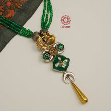 This one-of-a-kind Peacock Two Tone Silver Neckpiece is crafted with 92.5% silver and adorned with green kundan, green onyx and green semi precious beads, making it a perfect piece of jewellery for any special occasion.