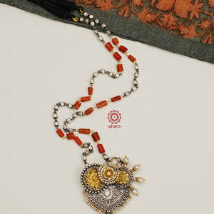 Beautifully crafted in silver with hints of gold tones, a perfect cockatoo motif with highlights of kundan and pearls, strung together on a silver bead chain with coral highlights.  A unique one of a kind piece that is a great addition to your wardrobe. 