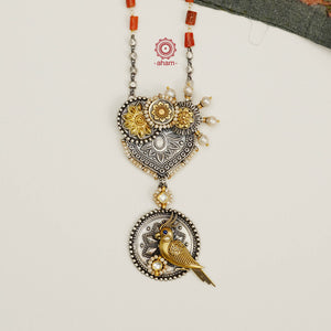 Beautifully crafted in silver with hints of gold tones, a perfect cockatoo motif with highlights of kundan and pearls, strung together on a silver bead chain with coral highlights.  A unique one of a kind piece that is a great addition to your wardrobe. 