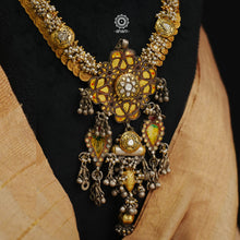 This is a truly statement piece that brings together three distinct styles of India in a beautiful harmonious way. Handmade in silver by the finest craftsmen of India.The base is of a Kasu mala, a traditional south Indian neckpiece. The word 'Kasu' means coin, and 'Mala' denotes necklace. The Kasumala is made up of small coins which are so closely strung together that they overlap one another.