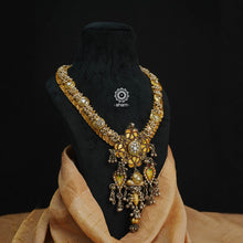 This is a truly statement piece that brings together three distinct styles of India in a beautiful harmonious way. Handmade in silver by the finest craftsmen of India.The base is of a Kasu mala, a traditional south Indian neckpiece. The word 'Kasu' means coin, and 'Mala' denotes necklace. The Kasumala is made up of small coins which are so closely strung together that they overlap one another.