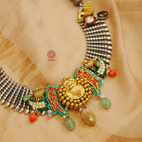 One of a kind statement wearable art pieces. An eclectic mix of elements, with a play of colours, textures, forms and workmanship. Crafted in Silver with two tones that makes this neckpiece so versatile and unique. This particular neckpiece features south Indian hair ornament as the center piece, beautiful parrots, Royal elephants, and exquisite peacocks. Modern Heirloom pieces that can be worn across generations.