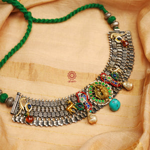 One of a kind statement wearable art pieces. An eclectic mix of elements, with a play of colours, textures, forms and workmanship. Crafted in Silver with two tones that makes this neckpiece so versatile and unique. Intricately detailed 3d peacock takes center stage in this neckpiece, two kundan peacocks on the side, with reindeers and parrots to add to the charm. Modern Heirloom pieces that can be worn across generations.