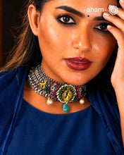 One of a kind statement wearable art pieces.&nbsp;An eclectic mix of elements, with a play of colours, textures, forms and workmanship. Crafted in Silver with two tones that makes this neckpiece so versatile and unique. Intricately detailed 3d peacock takes center stage in this neckpiece, two kundan peacocks on the side, with reindeers and parrots to add to the charm. Modern Heirloom pieces that can be worn across generations.