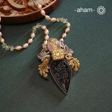 Introducing our Noori Two Tone Silver Neckpiece - a one-of-a-kind accessory crafted in 92.5 silver. This unique pendant features a beautifully carved black onyx, detailed peacocks on each side, and kundan highlights. Complete with a unique chain, this neckpiece is sure to make a statement and elevate any outfit.