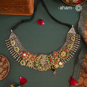 One of a kind statement wearable art pieces. An eclectic mix of elements, with a play of colours, textures, forms and workmanship. Crafted in silver with two tones that makes this neckpiece so versatile and unique. Comes with Intricately detailed pices and kundan highlights, all crafted in 92.5 silver. A modern Heirloom piece that can be worn across generations.