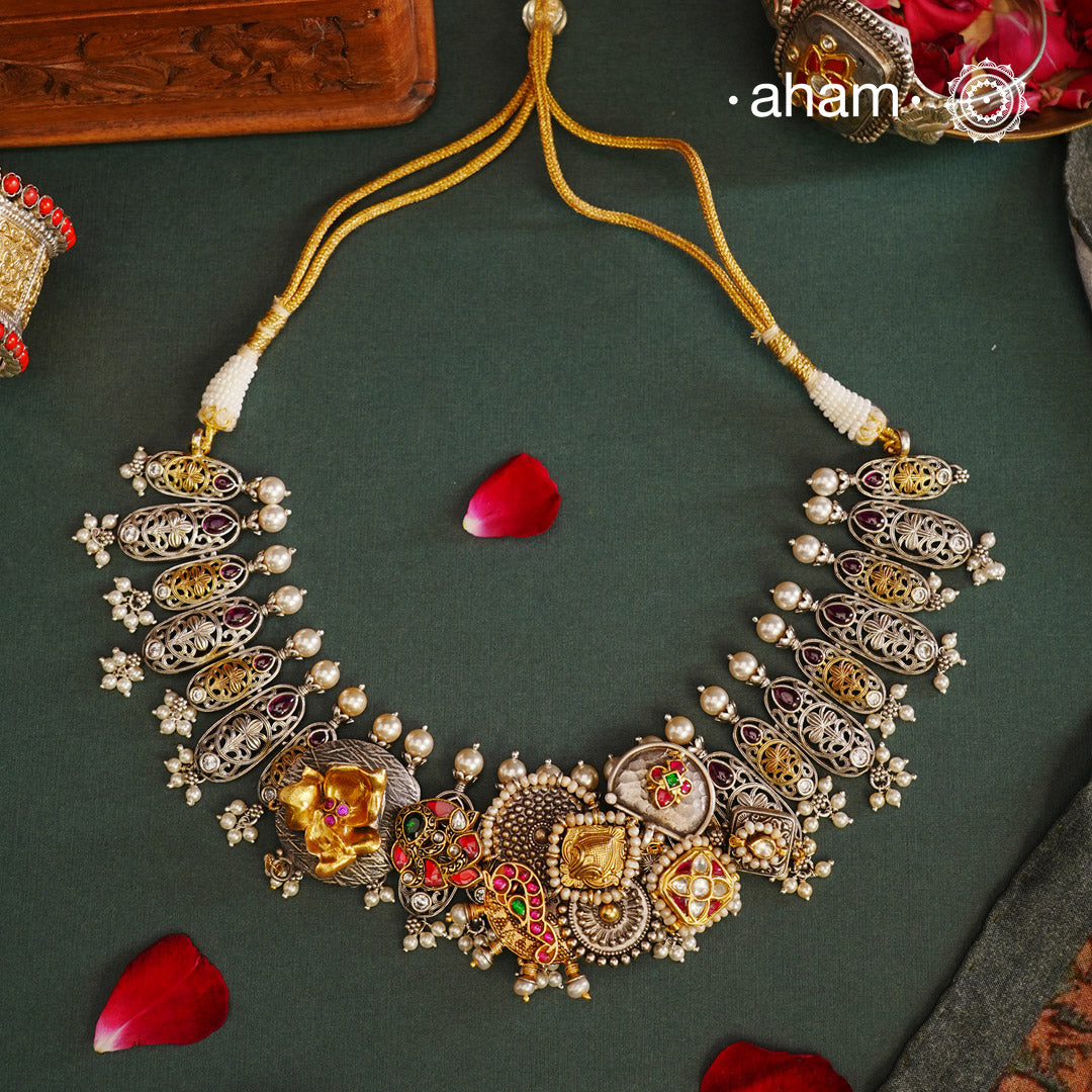 One of a kind statement wearable art pieces. An eclectic mix of elements, with a play of colours, textures, forms and workmanship. Crafted in Silver with two tones and kundan highlights and beautiful cultured pearls that makes this neckpiece so versatile and unique. Modern Heirloom pieces that can be worn across generations.