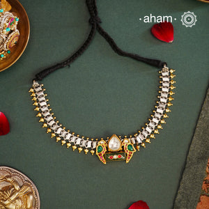 Classic dual tone neckpiece crafted in 92.5 silver with gold highlights, comes with a beautiful center pendant with birds on either sides . Perfect neckpiece to add subtle elegance to your attire.