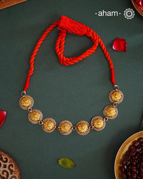 Enhance your style with the timeless elegance of the Dual Tone Silver Choker which can also be worn lower around the neck. Handcrafted by skilled karigars in Barmer, Rajasthan, this neckpiece features traditional Bandhel work, where a thin sheet of hand beaten 22 carat gold is set on 92.5 silver using a unique wax setting technique. A classic representation of fine Indian traditional craftsmanship.&nbsp;