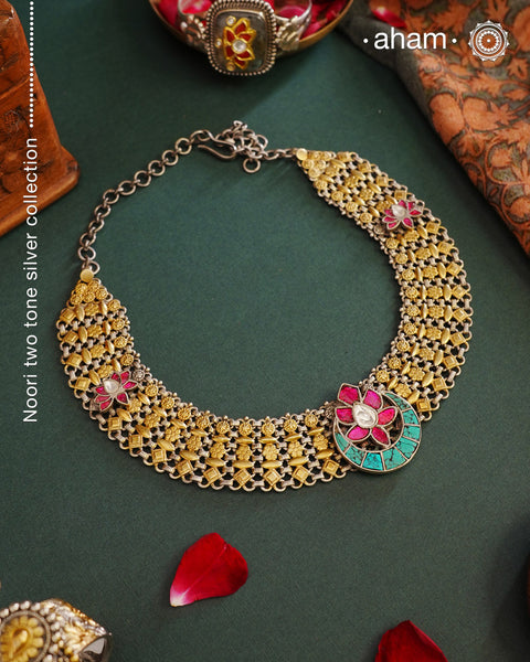 Expertly crafted with 92.5 silver, the Noori Two Tone Silver Neckpiece exudes elegance with its dual tone design. The striking pink and turquoise kundan lotus highlights add a touch of glamour to this stunning piece. Elevate any outfit with this exquisite neckpiece. Perfect for intimate family gatherings and festivities.