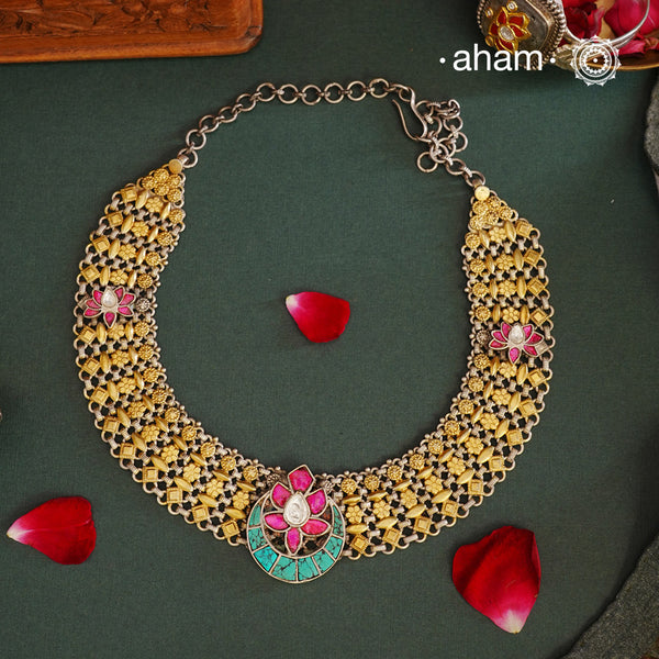 Expertly crafted with 92.5 silver, the Noori Two Tone Silver Neckpiece exudes elegance with its dual tone design. The striking pink and turquoise kundan lotus highlights add a touch of glamour to this stunning piece. Elevate any outfit with this exquisite neckpiece. Perfect for intimate family gatherings and festivities.