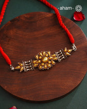 Enhance your style with the timeless elegance of the Dual Tone Silver Choker. Handcrafted by skilled karigars in Barmer, Rajasthan, this neckpiece features traditional Bandhel work, where a thin sheet of hand beaten&nbsp;22 carat gold is set on 92.5 silver using a unique wax setting technique. A classic representation of fine Indian traditional craftsmanship.