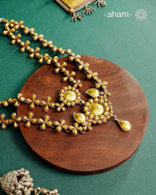 Enhance your style with the timeless elegance of the Dual Tone Silver Neckpiece. Handcrafted by skilled karigars in Barmer, Rajasthan, this earring features traditional Bandhel work, where a thin sheet of hand beaten&nbsp;22 carat gold is fused with 92.5 silver and then set on 92.5 silver using a unique wax filling technique. A classic representation of Indian craftsmanship.