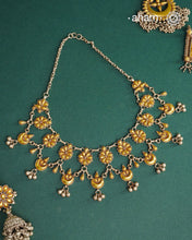Enhance your style with the timeless elegance of the Dual Tone Silver Neckpiece. Handcrafted by skilled karigars in Barmer, Rajasthan, this earring features traditional Bandhel work, where a thin sheet of hand beaten&nbsp;22 carat gold is fused with 92.5 silver and then set on 92.5 silver using a unique wax filling technique. A classic representation of Indian craftsmanship.