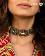 A singular artistic creation, this Nandi choker exemplifies masterful silversmithing. Executed in dual-tone silver with kundan inlay work, it presents a sophisticated composition of layered textures and chromatic variation. The piece demonstrates refined technical execution through its balanced interplay of sculptural forms and ornamental detailing. Conceived as a generational heirloom, its timeless construction and versatile aesthetic ensure enduring relevance across occasions and eras, positioning it as b