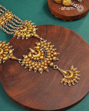 Enhance your style with the timeless elegance of the Dual Tone Silver Neckpiece. Handcrafted by skilled karigars in Barmer, Rajasthan, this earring features traditional Bandhel work, where a thin sheet of hand beaten&nbsp;22 carat gold is fused with 92.5 silver and then set on 92.5 silver using a unique wax filling technique. A classic representation of Indian craftsmanship.