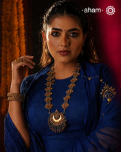 Enhance your style with the timeless elegance of the Dual Tone Silver Neckpiece. Handcrafted by skilled karigars in Barmer, Rajasthan, this earring features traditional Bandhel work, where a thin sheet of hand beaten&nbsp;22 carat gold is fused with 92.5 silver and then set on 92.5 silver using a unique wax filling technique. A classic representation of Indian craftsmanship.&nbsp;