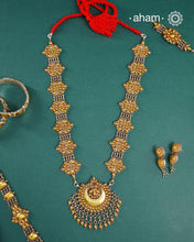 Enhance your style with the timeless elegance of the Dual Tone Silver Neckpiece. Handcrafted by skilled karigars in Barmer, Rajasthan, this earring features traditional Bandhel work, where a thin sheet of hand beaten&nbsp;22 carat gold is fused with 92.5 silver and then set on 92.5 silver using a unique wax filling technique. A classic representation of Indian craftsmanship.&nbsp;