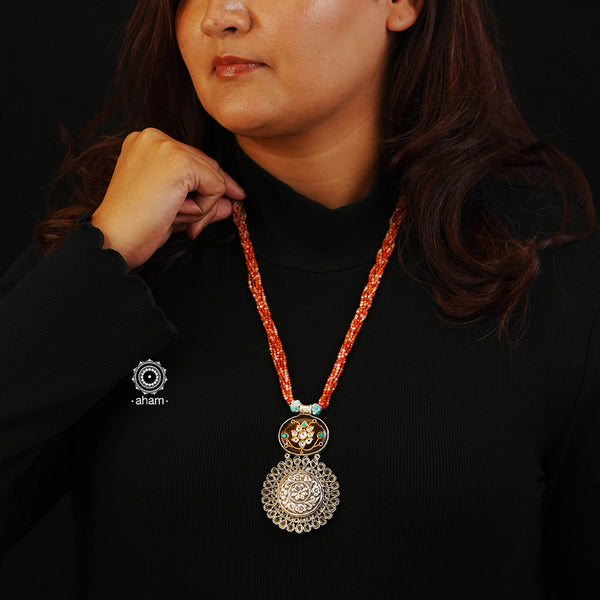 This stunning Ira silver neckpiece adds a unique and stylish flair to your look. Its one-of-a-kind design intertwines a beautiful 92.5 Sterling silver fusion pendant with semi precious bead strands, creating a truly statement-making accessory. Elevate your ensemble with this timeless and elegant piece.