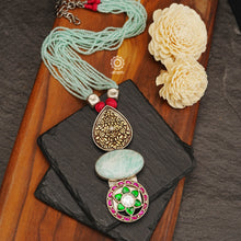 This exquisitely detailed Ira Stone Silver Neckpiece is the perfect choice for your next Cocktail Party evening. Its combination of classical design and modern materials ensures you will make an unforgettable statement. Handcrafted from sterling silver with an Amazonite stone and strands of sea blue beads, you'll be the star of the show.