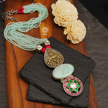 This exquisitely detailed Ira Stone Silver Neckpiece is the perfect choice for your next Cocktail Party evening. Its combination of classical design and modern materials ensures you will make an unforgettable statement. Handcrafted from sterling silver with an Amazonite stone and strands of sea blue beads, you'll be the star of the show.
