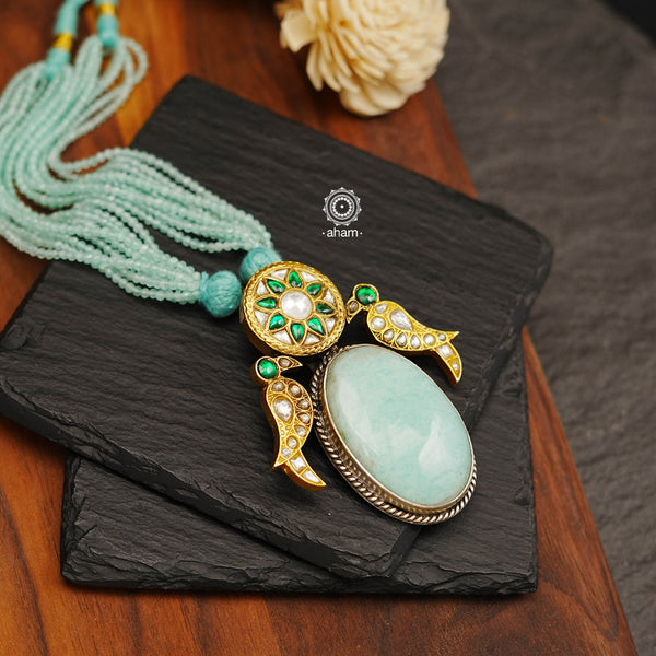 This Ira Drop Silver Neckpiece is perfect for any special occasion. Featuring a amazonite stone drop and two kundan work birds for added detail, this dual tone neckpiece is as versatile as it is stylish. Wear it short or long - the choice is yours.