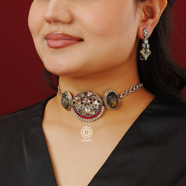 Flaunt this beautiful Ira Choker with intricate floral work. Beautiful, handcrafted silver necklace with pearls and semi precious stones. Looks great with both ethnic and western outfits.