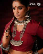 This 92.5 silver Ira neckpiece exemplifies understated elegance through meticulous craftsmanship. Fresh water pearl beads delicately laces the sterling silver, creating a sophisticated piece that sits gracefully below the neck. A testament to minimalist design principles and artisanal jewellery-making techniques.
